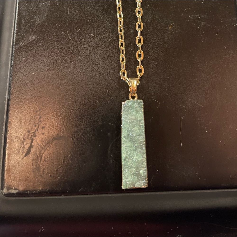 God tone chain necklace with green crystal pendant